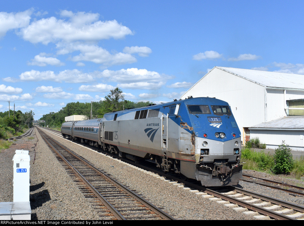 Amtrak P42 # 125 pushes the two car Shuttle Train # 464 out of the station toward its next stop of Hartford. Soon it will throttle up to 110 mph, the fastest speed allowed on the Springfield Line.